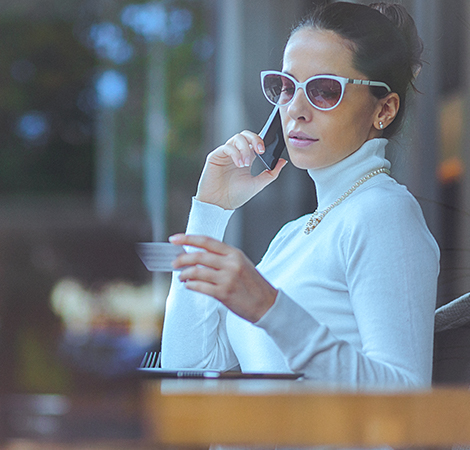 GettyImages-533047282 (1)_0 woman reviewing credit card purchases over the phone